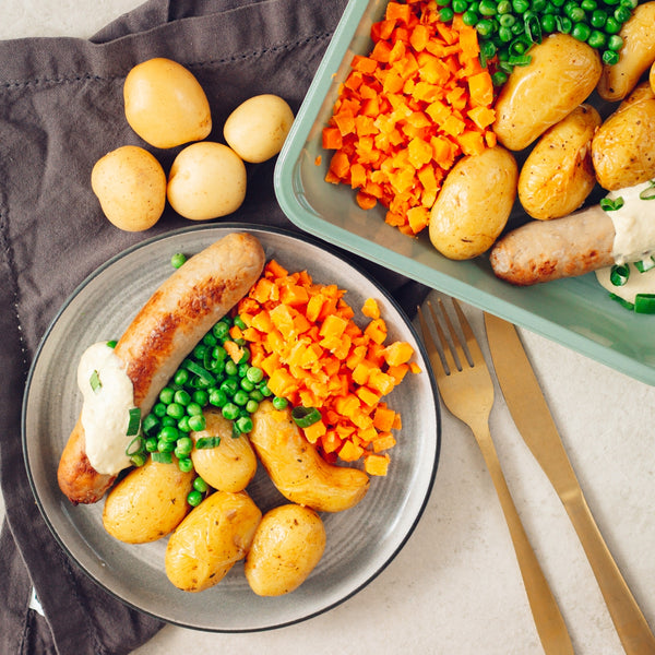 Saucisse de veau, petits pois carottes et grenailles